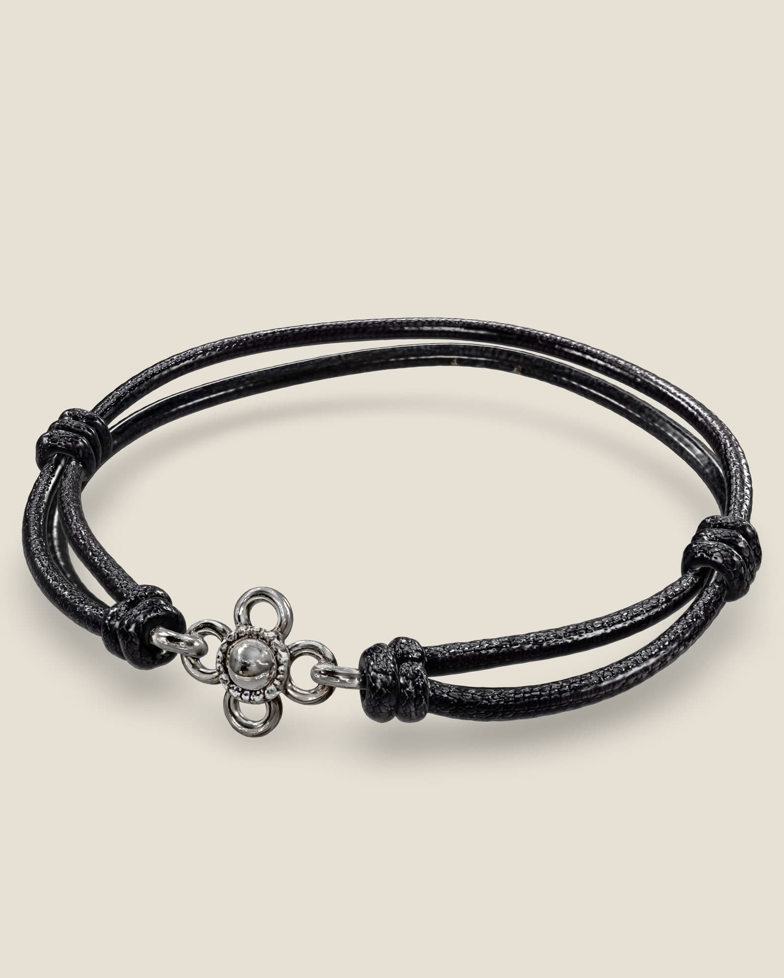 The Lotus in 3D, in black cord. Drag to turn it.