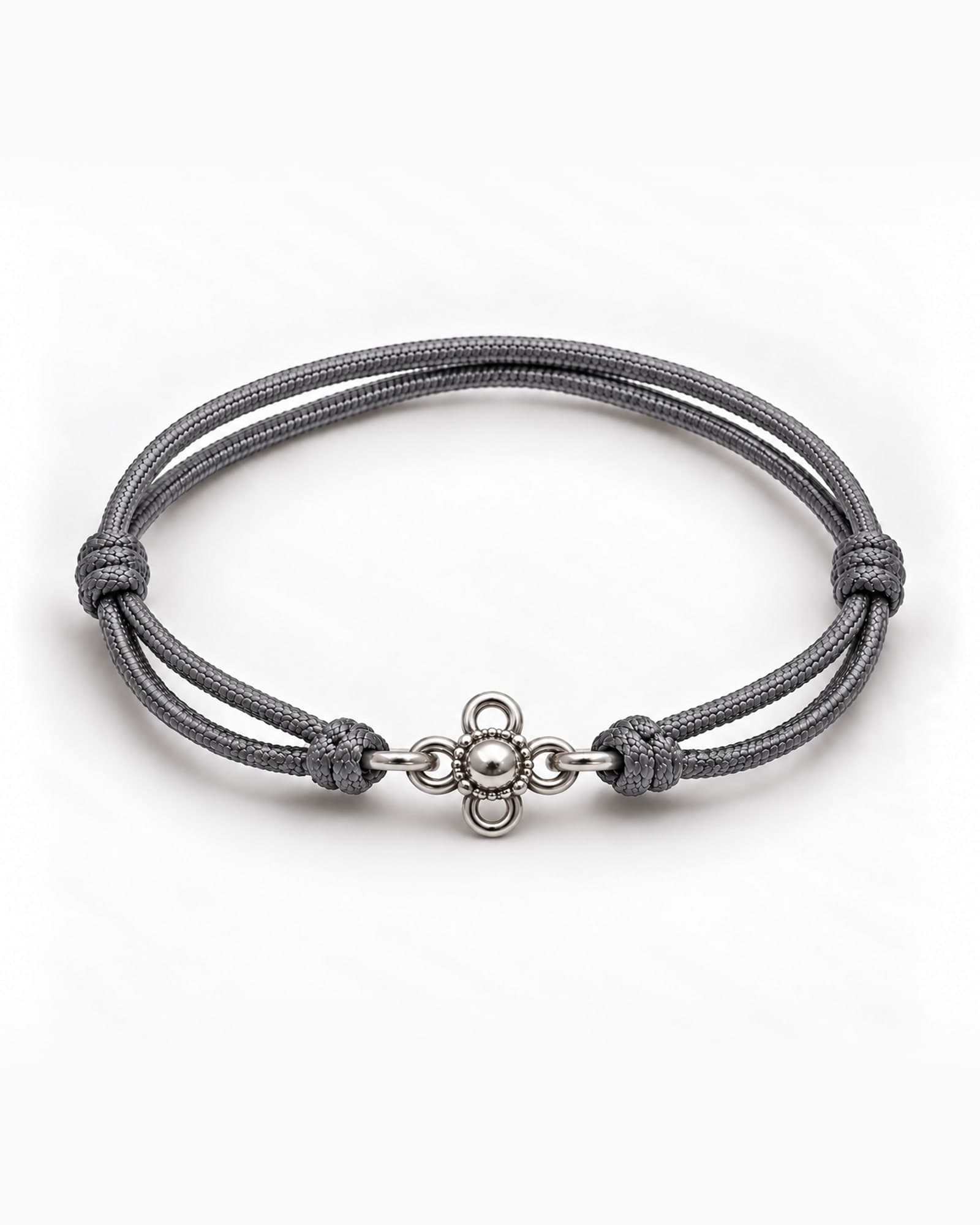 Lotus in sterling silver on Grey braided cord