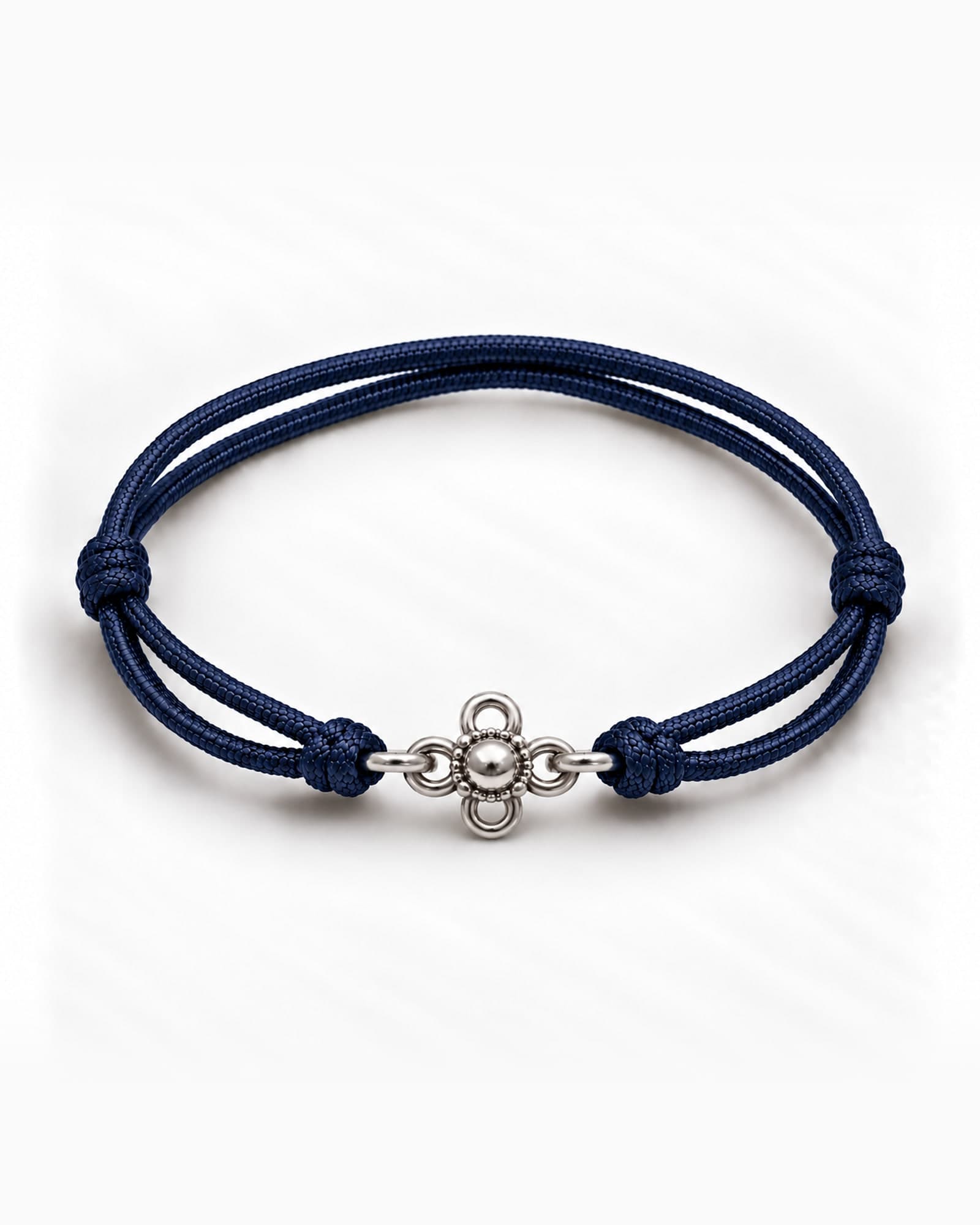 Lotus in sterling silver on Navy Blue braided cord