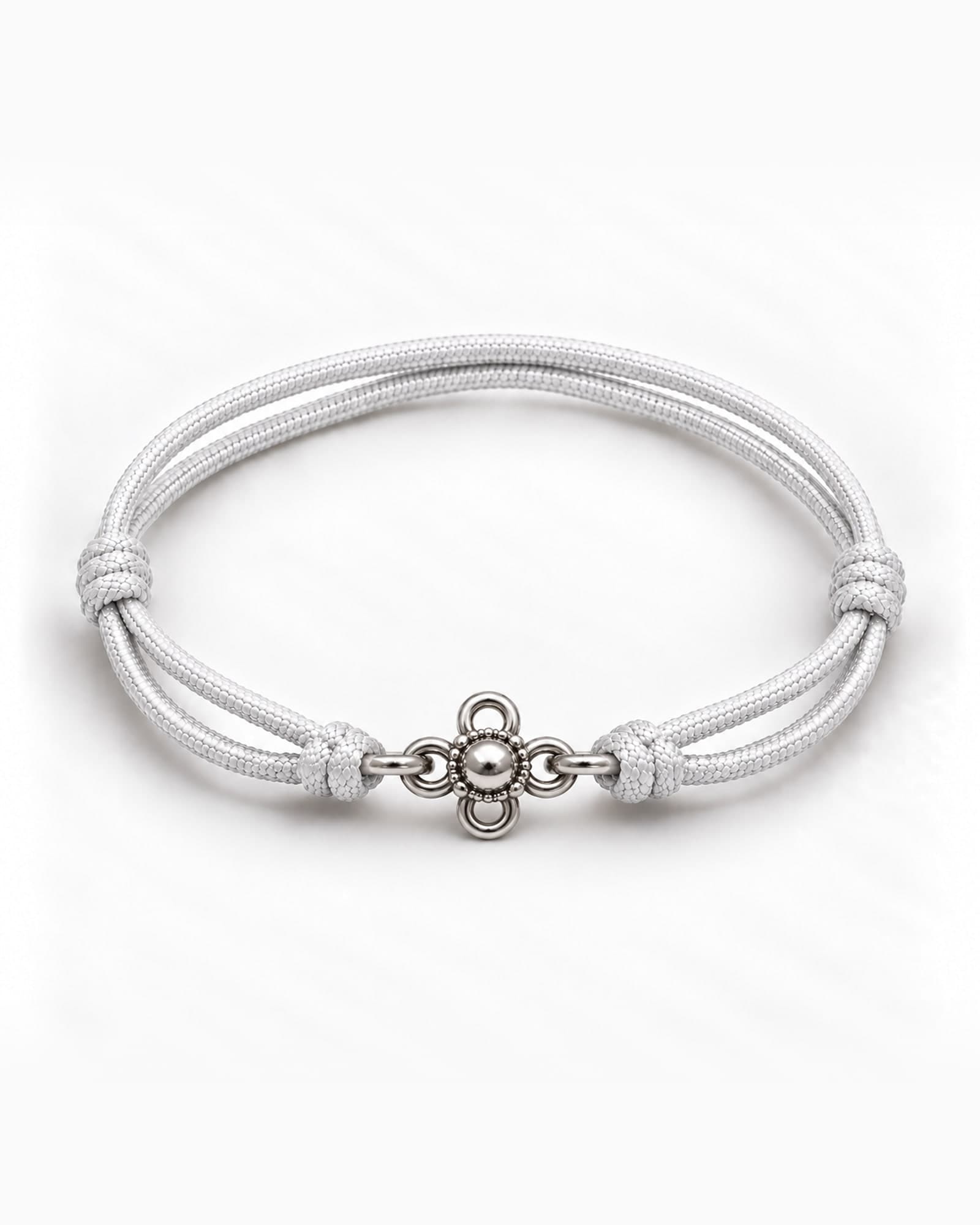 Lotus in sterling silver on White braided cord